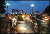 Night motorcyle traffic out of Trang Tien bridge. Hue, Vietnam (color)