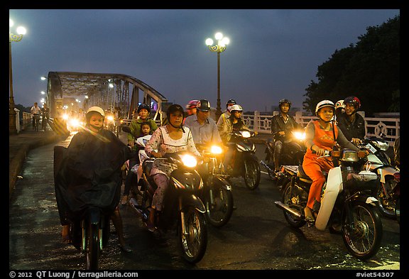 Mtorcylists by night, Trang Tien Bridge. Hue, Vietnam (color)