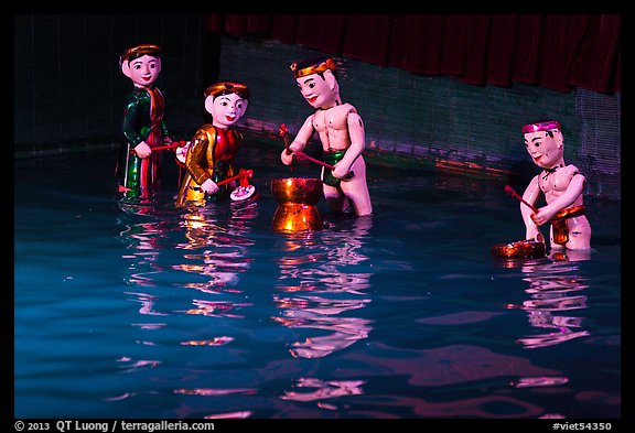 Water puppets (4 characters with musical instruments), Thang Long Theatre. Hanoi, Vietnam (color)
