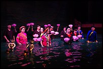Water puppet artists standing in pool after performance, Thang Long Theatre. Hanoi, Vietnam (color)