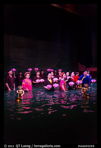 Water puppet artists receiving applause in pool after performance, Thang Long Theatre. Hanoi, Vietnam (color)