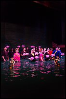 Water puppet artists receiving applause in pool after performance, Thang Long Theatre. Hanoi, Vietnam (color)