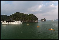 Tour boat and sea kayaks. Halong Bay, Vietnam ( color)