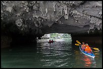 Paddling through Luon Cave tunnel. Halong Bay, Vietnam ( color)