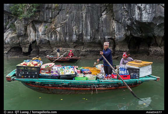 Grocer on rowboat. Halong Bay, Vietnam (color)