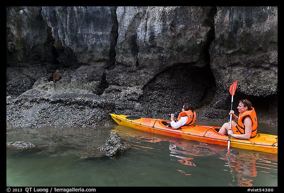Sea kayakers approaching monkey. Halong Bay, Vietnam (color)