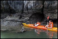 Sea kayakers approaching monkey. Halong Bay, Vietnam ( color)