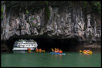 Kayaks floating through Luon Can tunnel. Halong Bay, Vietnam ( color)