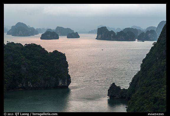 Elevated view of monolithic islands from above, evening. Halong Bay, Vietnam