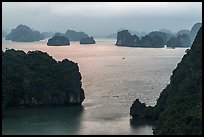 Elevated view of monolithic islands from above, evening. Halong Bay, Vietnam ( color)