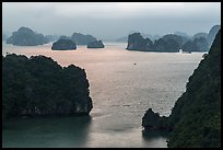 Elevated view of monolithic islands from above, evening. Halong Bay, Vietnam (color)