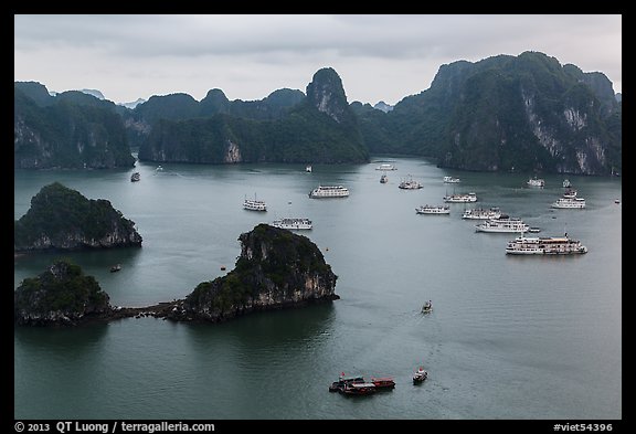 White tour boats and limestone islands covered in tropical vegetation. Halong Bay, Vietnam (color)