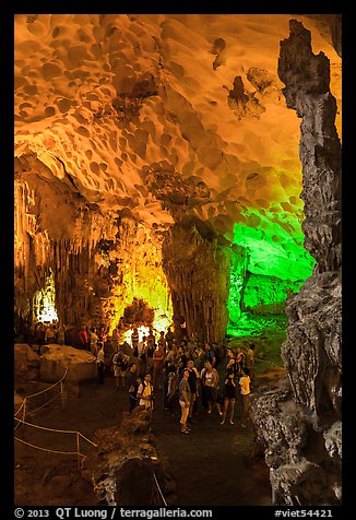 Tourists in first grotto, Surprise Cave. Halong Bay, Vietnam (color)