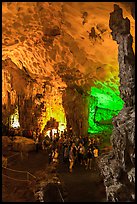 Tourists in first grotto, Surprise Cave. Halong Bay, Vietnam (color)