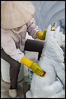 Woman polishing stone carving by hand. Vietnam ( color)