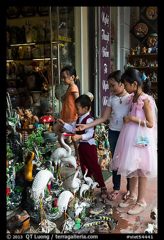 Children checkout ceramic store. Bat Trang, Vietnam