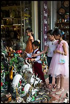 Children checkout ceramic store. Bat Trang, Vietnam (color)