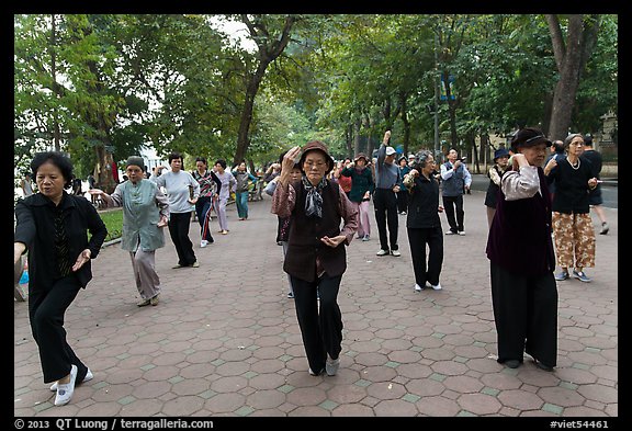 Group of women practising Tai Chi on Hoang Kiem lakeshore. Hanoi, Vietnam