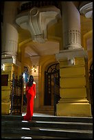 Woman in evening gown entering opera house. Hanoi, Vietnam (color)