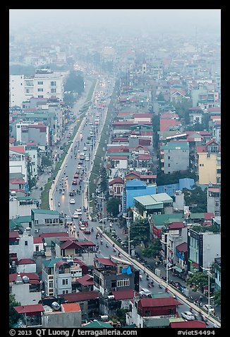 Expressway and buildings in mist seen from above. Hanoi, Vietnam (color)