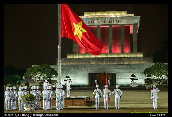 Lowering of flag in front of Ho Chi Minh Mausoleum at night. Hanoi, Vietnam (color)