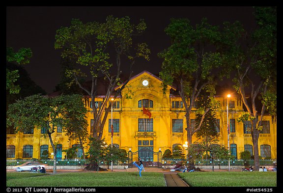 Colonial-area buildings bordering Ba Dinh Square at night. Hanoi, Vietnam (color)