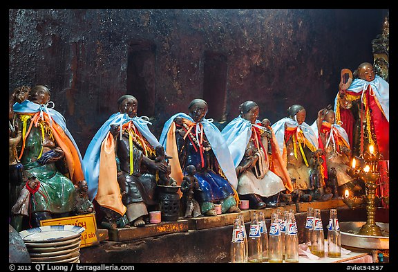 Ceramic figures of 12 women, each examplifying a human characteristic, Jade Emperor Pagoda, district 3. Ho Chi Minh City, Vietnam (color)