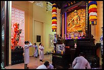 Women worshipping, An Quang Pagoda, district 10. Ho Chi Minh City, Vietnam ( color)