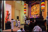 Women worshipping, An Quang Pagoda, district 10. Ho Chi Minh City, Vietnam (color)