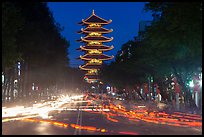 Traffic at night and Quoc Tu Pagoda, district 10. Ho Chi Minh City, Vietnam (color)