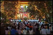 Worshippers at Quoc Tu Pagoda by night, district 10. Ho Chi Minh City, Vietnam ( color)