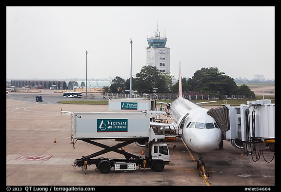 Airliner and control tower, Tan Son Nhat airport, Tan Binh district. Ho Chi Minh City, Vietnam (color)