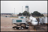 Airliner and control tower, Tan Son Nhat airport, Tan Binh district. Ho Chi Minh City, Vietnam (color)