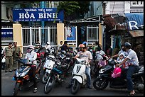 Parents waiting to pick up children in front of school. Ho Chi Minh City, Vietnam (color)