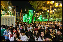 Street filled with crowds on Christmas eve. Ho Chi Minh City, Vietnam (color)