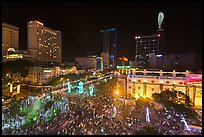 Crowded intersection at night from above, during holidays. Ho Chi Minh City, Vietnam (color)