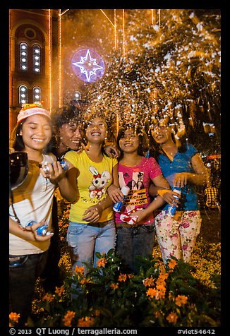 Young Revellers in front of Notre Dame Cathedral on Christmas Eve. Ho Chi Minh City, Vietnam