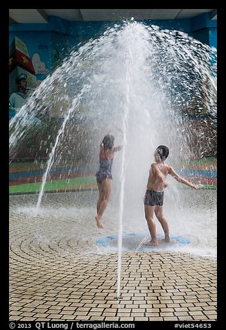 Children in fountain, Dam Sen Water Park, district 11. Ho Chi Minh City, Vietnam (color)