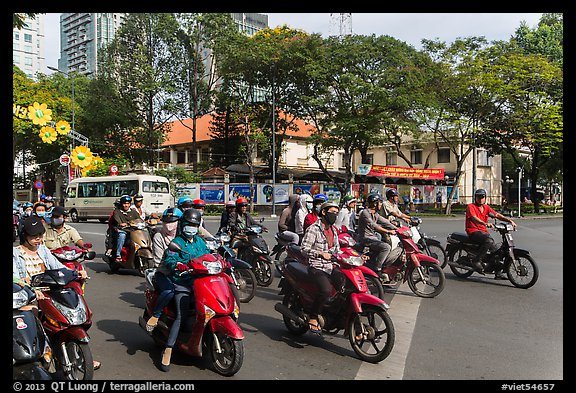 Motorbike riders waiting at intersection. Ho Chi Minh City, Vietnam