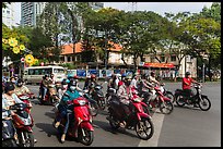 Motorbike riders waiting at intersection. Ho Chi Minh City, Vietnam