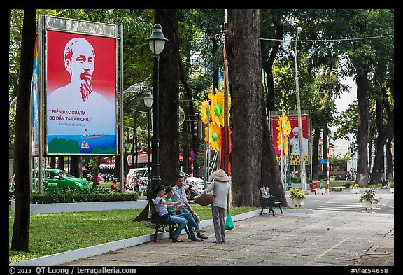 Family chatting with vendor in park. Ho Chi Minh City, Vietnam