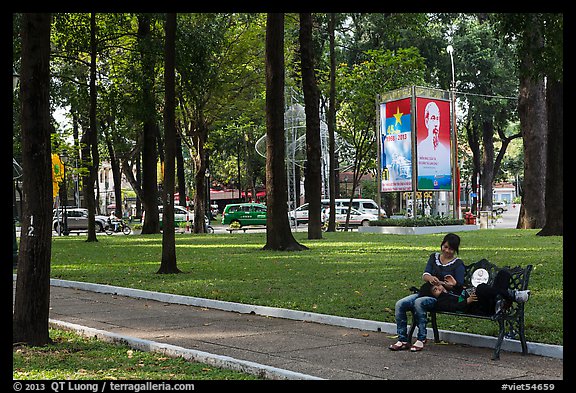 Relaxing on a public bench in park. Ho Chi Minh City, Vietnam