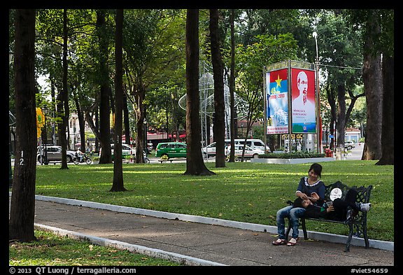 Relaxing on a public bench in April 30 Park. Ho Chi Minh City, Vietnam