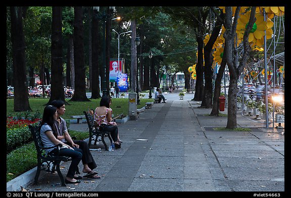 Park sidewalk at dusk. Ho Chi Minh City, Vietnam (color)