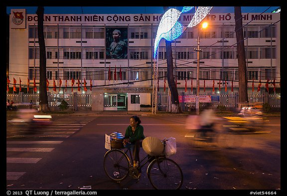 Vendor with bicycle at night. Ho Chi Minh City, Vietnam (color)