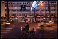 Vendor with bicycle at night. Ho Chi Minh City, Vietnam (color)