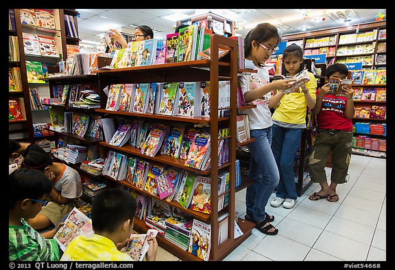 Bookstore shelves and children reading. Ho Chi Minh City, Vietnam (color)