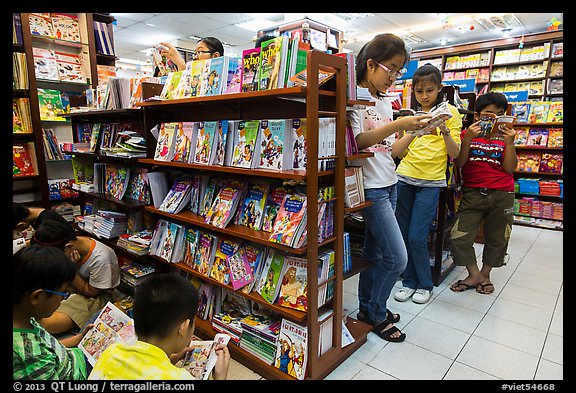 Bookstore shelves and children reading. Ho Chi Minh City, Vietnam