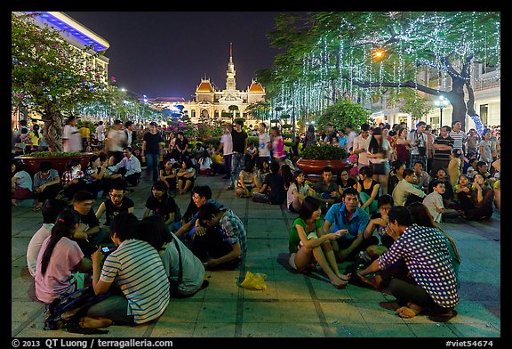 Groups in front of City Hall on New Year eve. Ho Chi Minh City, Vietnam (color)