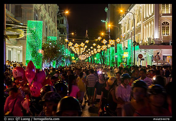 Packed street at night, New Year eve. Ho Chi Minh City, Vietnam (color)
